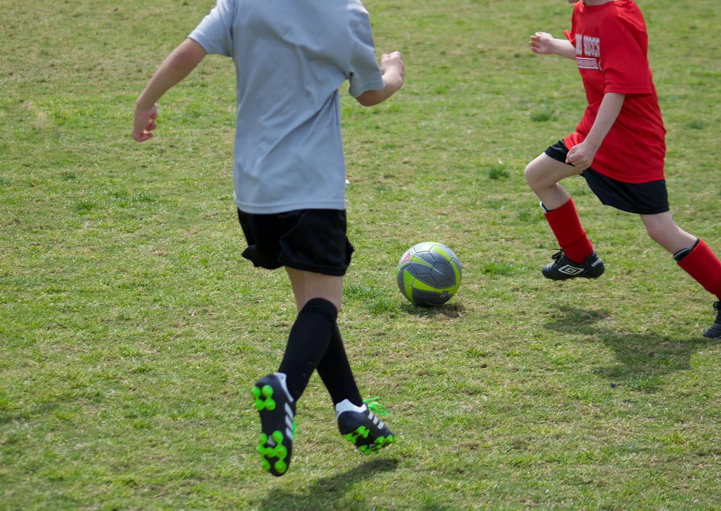 Two boys playing football