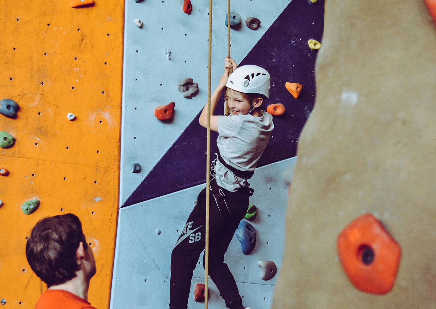 A child climbs a wall